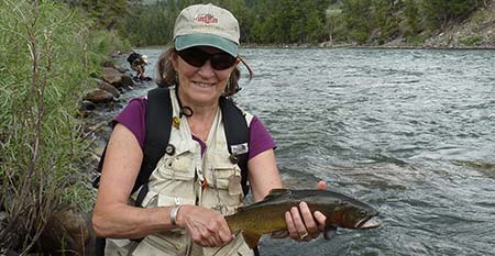 Angler with Yellowstone River cutthroat trout
