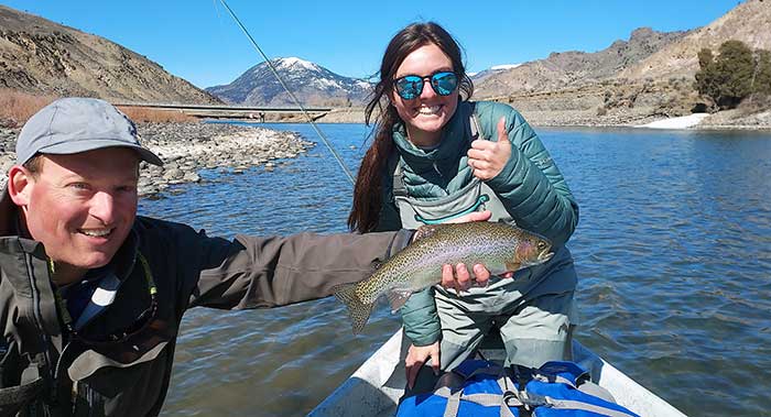 Happy angler and guide on early spring Yellowstone River