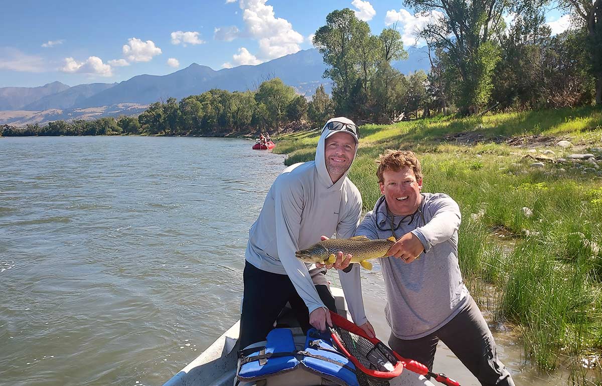 angler and guide with brown trout on Yellowstone River