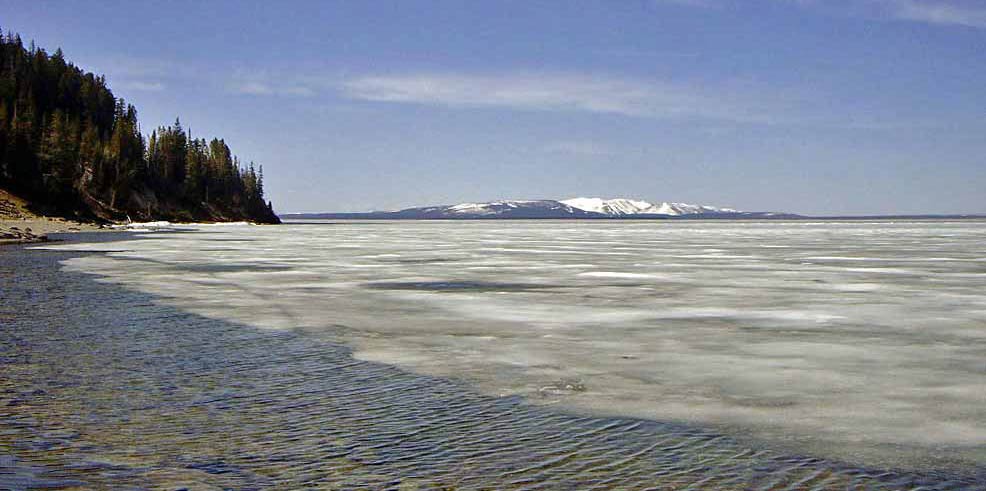 still frozen Yellowstone Lake in Yellowstone Park