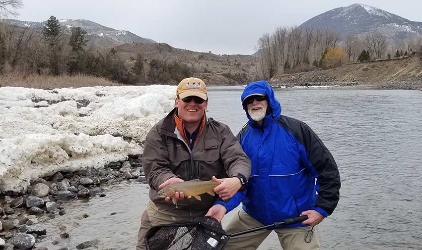 angler and guide with trout and ice shelves