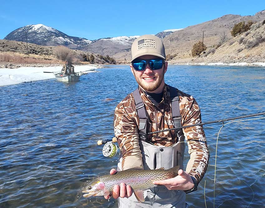 beginner angler with solid trout
