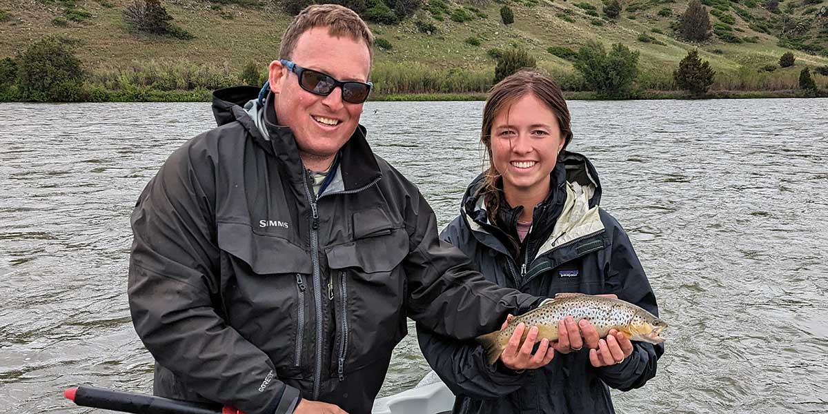 decorative image showing a fly fishing scene. may include happy angler, trout, scenery, etc