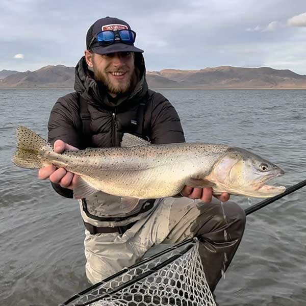 photo of guide chase kolbye with large trout