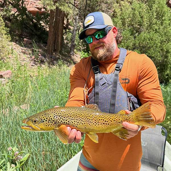 photo showing guide dewey seibert with large brown trout