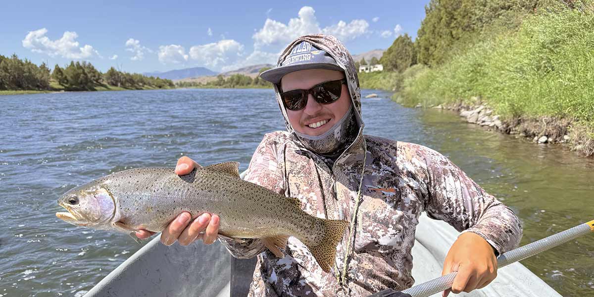 decorative image showing a fly fishing scene. may include happy angler, trout, scenery, etc