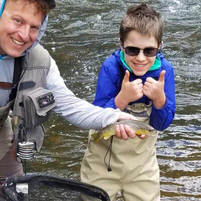 photo demonstrates a wade fishing trip with yellowstone country fly fishing