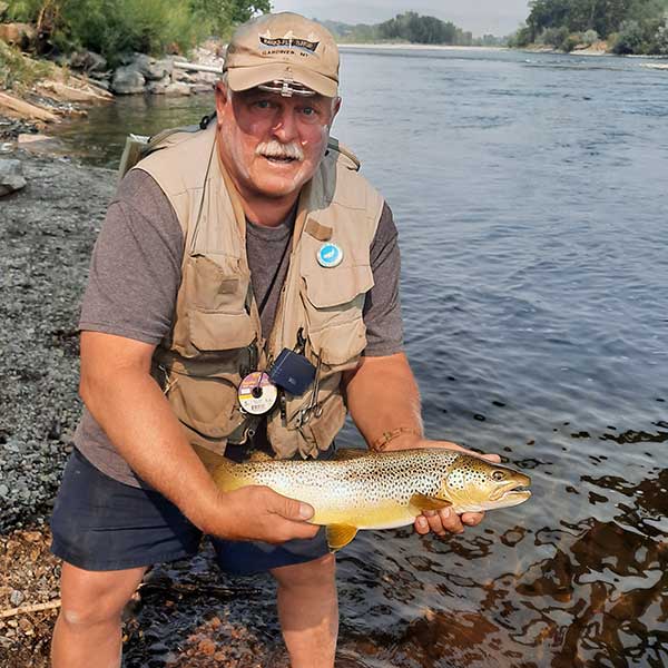 angler and large hopper-eating brown on the Yellowstone